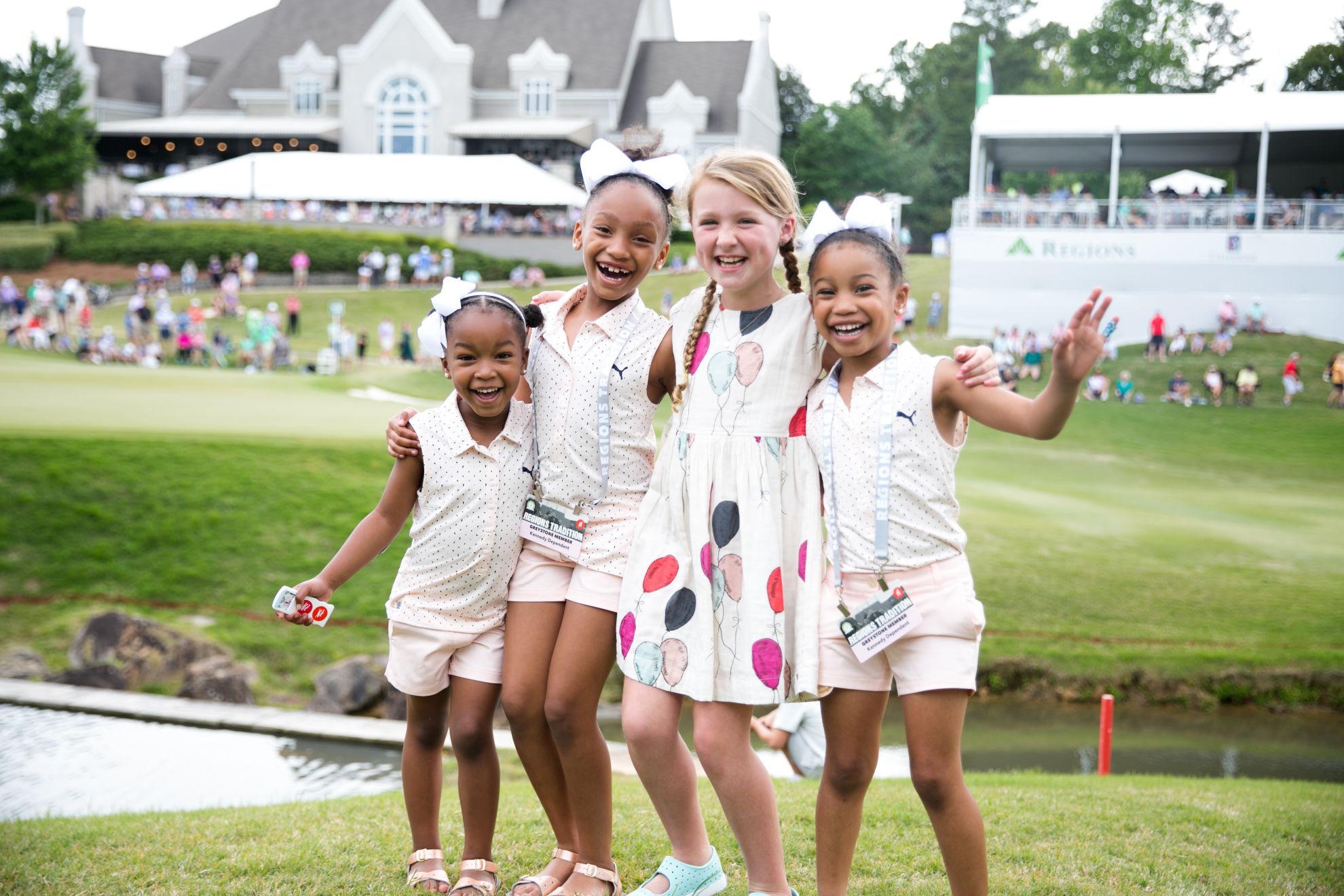 Young girls smiling in a group shot at the 2021 Regions Tradition at Greystone. hoto credit Grace Vroom, Bruno Events